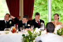 Bride, Groom and best man enjoy a speech after dinner
