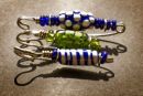 Three focal bead brooches