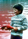 Boy with pilot whale foetus, Faroe Islands
