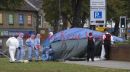 Stabbing outside Asda, Bexleyheath, Kent. Body still under tarp. Bicycle believed to be involved in the case.