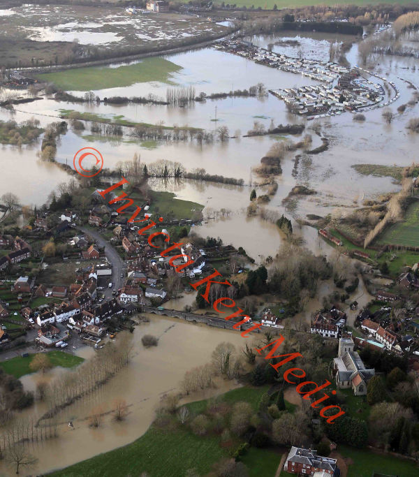 PICS SHOWS;Yalding in Kent still surrounded by Flood water with heavy rain and Flooding Due This evening. Little Venice static Mobile Home site Still under water with Yalding in The Background