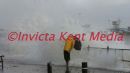 PIC SHOWS ;STORMS RAGE IN KENT AREA;A PEDESTRIAN GETS KNOCKED OVER BY STRONG WAVES WHILE WALKING ALONG DOVER SEAFRONT